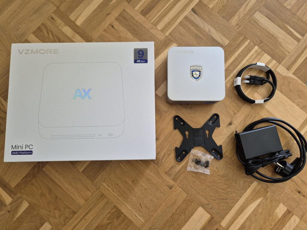 Lieferumfang: Mini-PC, 120-W-Netzteil, HDMI-Kabel, VESA-Halterung mit Schrauben.